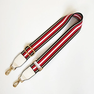 Adjustable wide replacement bag strap with red, white and black woven ethnic stripes