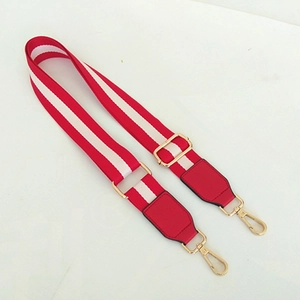 Adjustable red and white striped canvas bag strap with red leather ends and gold hardware