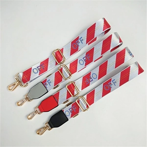 Adjustable crossbody bag strap with red white stripes and OFF lettering on woven fabric