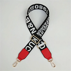 Adjustable woven shoulder strap with letter pattern and red leather details for handbags