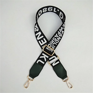 Adjustable wide replacement strap with black and white jacquard lettering and gold hardware