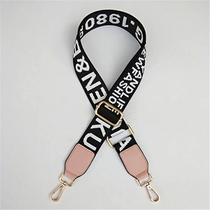 Adjustable black and white jacquard strap with pink leather ends and gold hooks