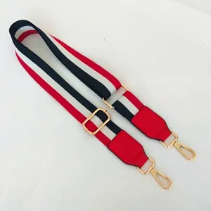 Adjustable red white and blue striped fabric shoulder strap with gold metal hooks