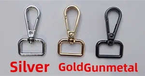 Close-up of swivel lobster clasps in silver, gold, and gunmetal finishes for bag straps
