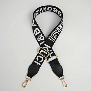 Adjustable wide woven shoulder strap with letter jacquard and gold hardware details