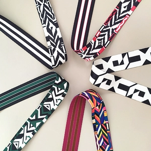 Detail shot of colorful woven shoulder straps with geometric and ethnic patterns