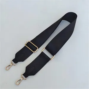 Adjustable black nylon wide shoulder strap with gold hardware for crossbody bags