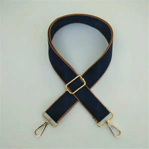 Adjustable navy blue crossbody strap with brown edges and golden swivel hooks