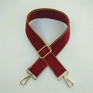 Adjustable burgundy wide shoulder strap with gold metal hooks for crossbody bags