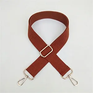 Adjustable brown cotton shoulder strap replacement with elegant gold metal buckles