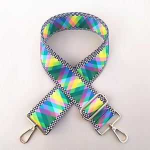 Close-up of adjustable ethnic style wide bag strap with colorful diamond patterns