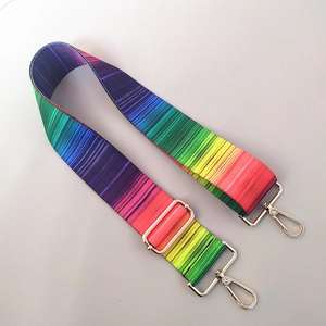 Detail of adjustable colorful striped strap with durable golden metal lobster clasps