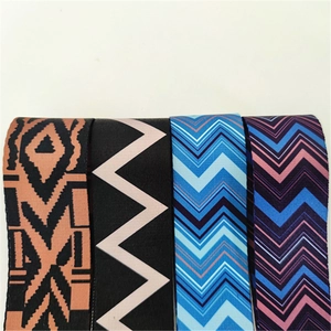 Detail of four colorful geometric patterned adjustable thick shoulder straps for bags