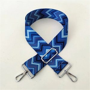 Adjustable wide replacement bag strap with blue and black zigzag wave pattern and metal clips