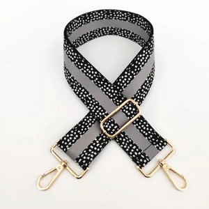 Adjustable 5cm wide patterned shoulder strap with gold metal hooks and reflective strip