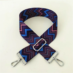 Detail of colorful zigzag wide bag strap with silver metal swivel hooks and adjuster