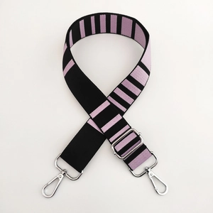 Detail of adjustable black and purple striped shoulder strap with silver metal buckles