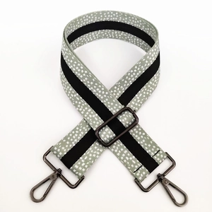 Close-up of 5cm wide adjustable shoulder strap with grey spotted pattern and metal buckles