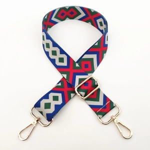 Ethnic geometric jacquard wide shoulder strap with polished gold-tone metal swivel hooks