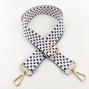 Adjustable wide replacement strap with blue woven star pattern and gold metal hooks