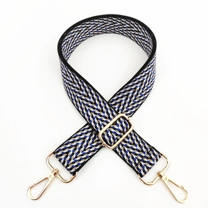 Detail of blue and white herringbone woven strap with golden metal lobster hooks