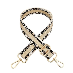 Detail of leopard print bag strap with golden metal lobster clasps and buckle