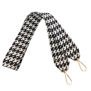 Wide black and white houndstooth bag strap with gold lobster clasps for shoulder bags