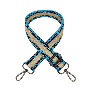 Detail of blue leopard print strap with gold glitter stripe and vintage bronze hooks