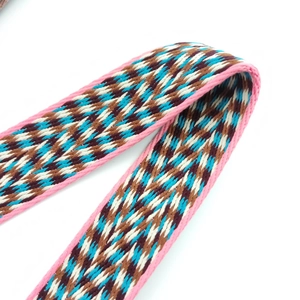 Close-up of jacquard woven geometric wave pattern on adjustable shoulder strap for bags