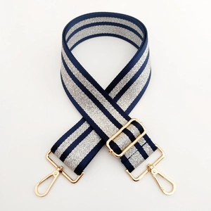 Detail of adjustable blue and silver metallic glitter wide strap with gold hardware