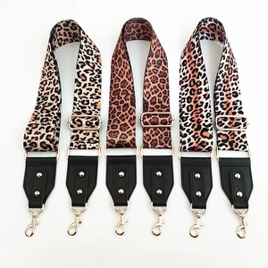Adjustable leopard print bag straps with gold metal buckles and black leather connectors