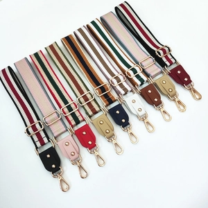 Adjustable wide woven shoulder straps with colorful stripe patterns and gold metal hooks
