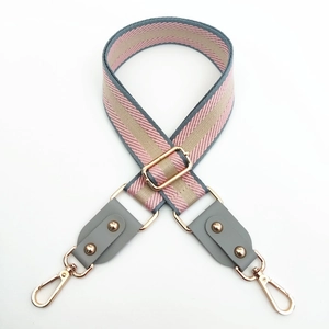 Adjustable striped woven bag strap in pink and grey with rose gold metal hardware
