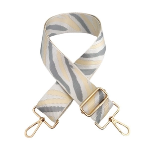 Adjustable wide striped nylon shoulder strap with zebra pattern and gold metal hardware