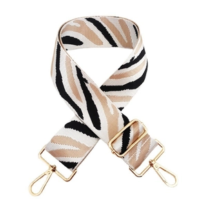 Adjustable nylon shoulder strap with zebra stripe pattern and gold metal hardware