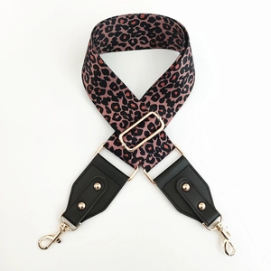 Detail of leopard print wide bag strap with gold lobster clasps and leather ends
