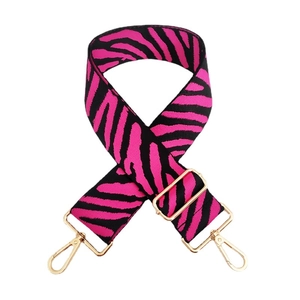 Adjustable zebra print bag strap in pink and black with golden lobster clasps