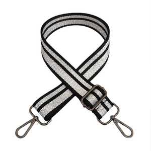 Macro detail of the adjustable black and silver striped strap with gunmetal swivel hooks