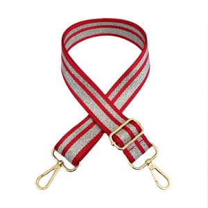 Close-up of red and silver striped wide bag strap with golden metal swivel hooks