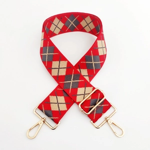 Adjustable wide replacement bag strap with red and beige argyle pattern and gold metal hooks