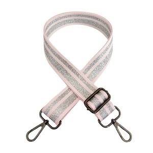 Close-up of adjustable pink and silver glitter bag strap with vintage metal hooks