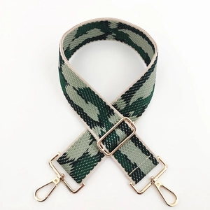Adjustable wide replacement bag strap with green and beige geometric woven patterns