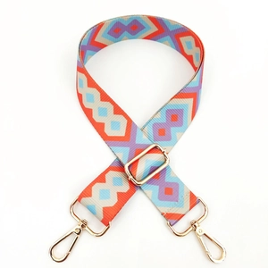 Detail of adjustable geometric ethnic strap with colorful weave and gold metal hooks