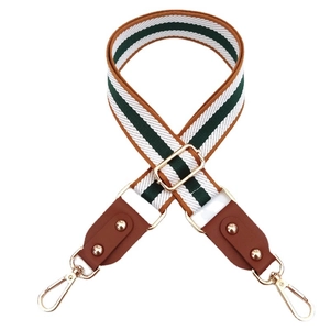 Adjustable striped shoulder strap with green, white, and brown patterns and gold hardware