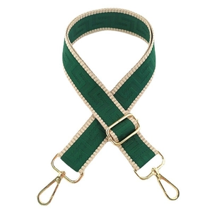 Detailed view of adjustable dark green and beige jacquard woven bag strap with gold metal hooks