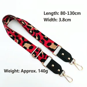 Adjustable leopard print bag strap with gold metal hardware and black leather ends