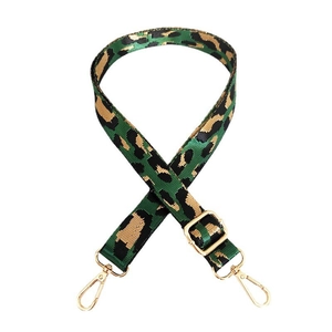 Detail of adjustable leopard print bag strap with high-quality gold metal hardware