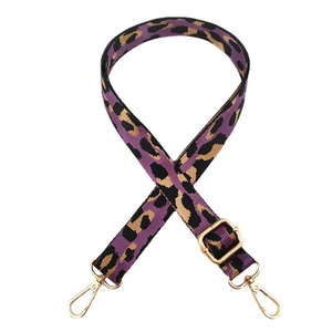 Detail of adjustable purple leopard print wide strap with gold metal lobster clasps