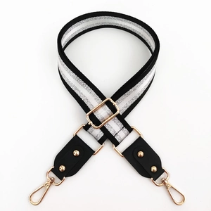 Adjustable black shoulder strap with silver glitter stripes and golden metal clasps