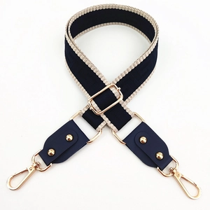 Adjustable navy blue and beige jacquard strap with gold hardware and logo pattern